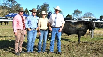 Brian Kennedy, Elders Stud Stock, Jack and Georgia Laurie from Knowla Livestock with auctioneer Paul Dooley. Pictures by Samantha Townsend 