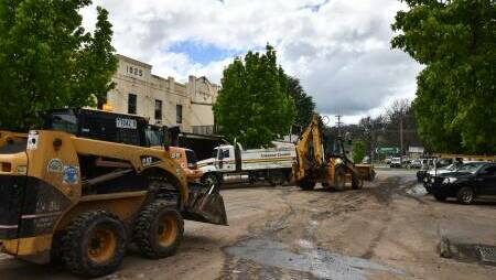 Work begins on the clean-up on Molong's main street. Picture by Carla Freedman.