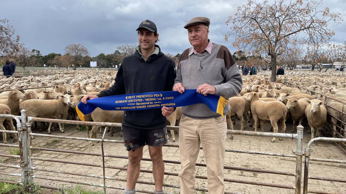 Mitch Haddrill, Ariah Park, and Barry Harper, Australian Border Leicester Association, with the best presented pen of ewes. Photo by Alexandra Bernard.