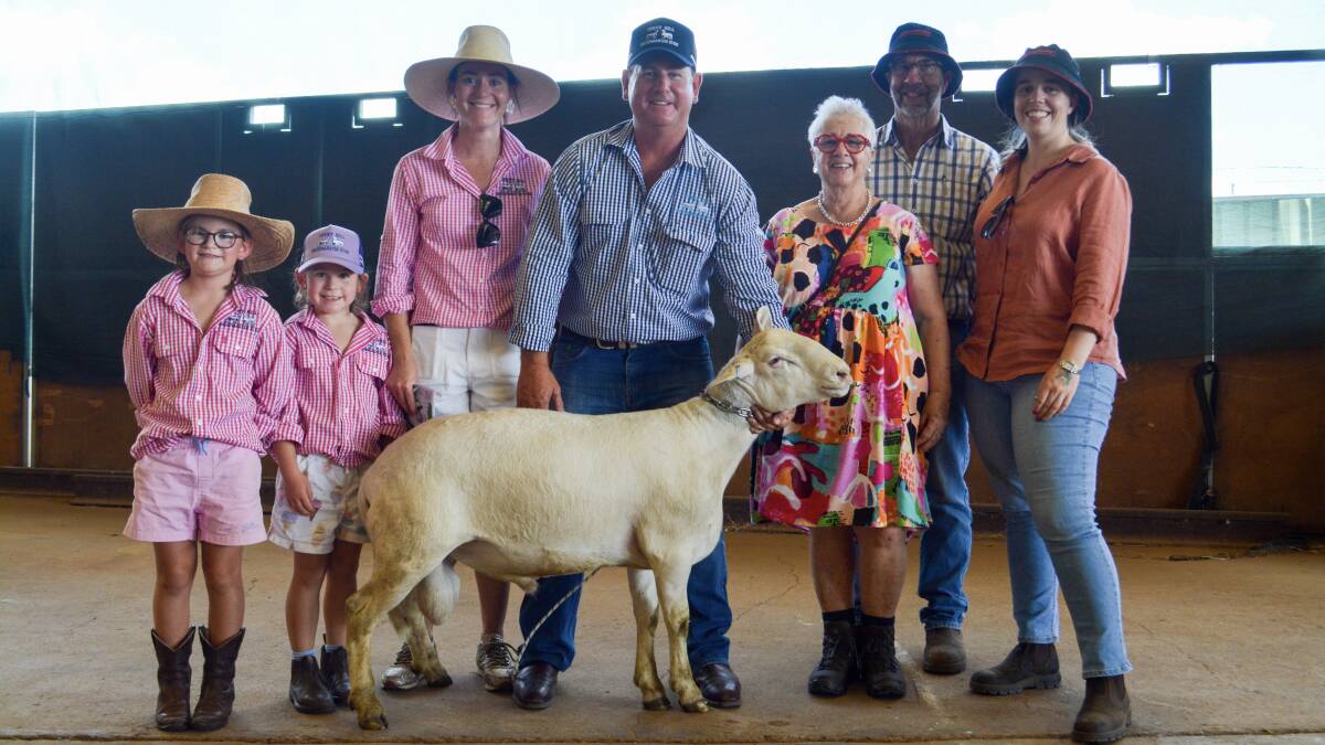 Lucy, 7, Pippi, 6, Marg and Aaron Nicholls, Ferny Hill SheepMaster stud, Gundagi, and buyers Veila, Mike and Tessa O'Hare, Wild Oat SheepMaster Stud, Beckhom, with Ferny Hill 129.