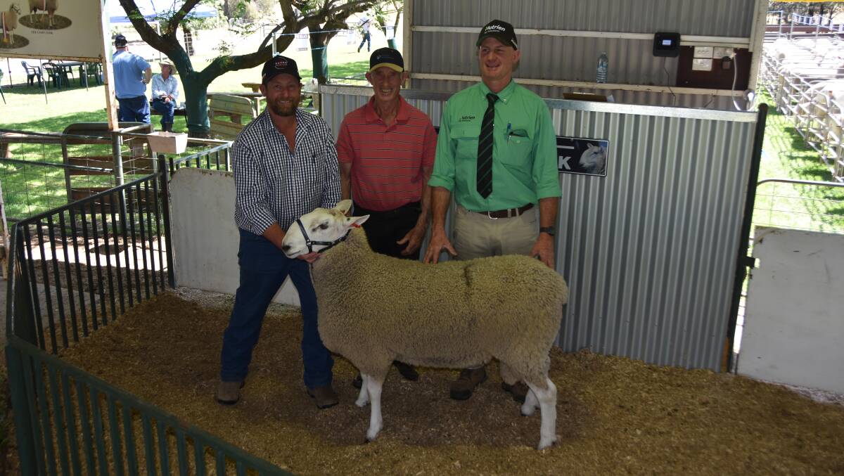 Top-priced ram of the sale, Bauer 46/22, purchased by Kobbadah Pastoral Company, Binda, for $6000, with Jamie Buerckner, Bauer Retallack, Richard Fraser, Kobbadah Pastoral Company and James Croker, Nutrien Wagga Wagga. Photo by Helen De Costa. 