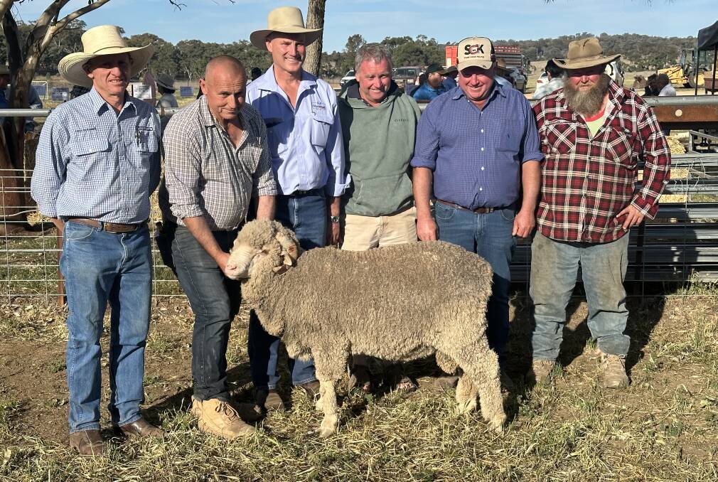 Top-price ram selling to The Doherty Brothers, Goolma, for $3600, with Jamie Stuart, Milling Stuart Pty Ltd, Dunedoo, Tony Indler, Allendale Merinos, Wellington, Andrew Mills, MacDonald and Co Woolbrokers, Dubbo, Peter, Mark and Colin Doherty, Goolma. Photo supplied. 