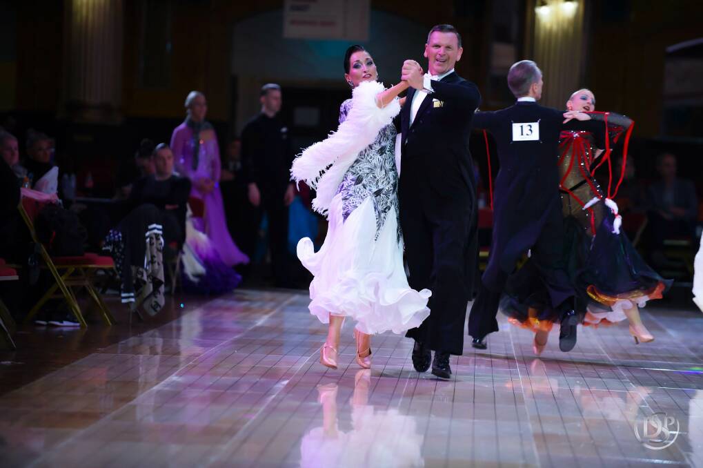 John Thomas and his coach Jody Rollason show their style which has seen them claim Australian and British ballroom championships. Picture: Alex Rowan of Dancesport Photography