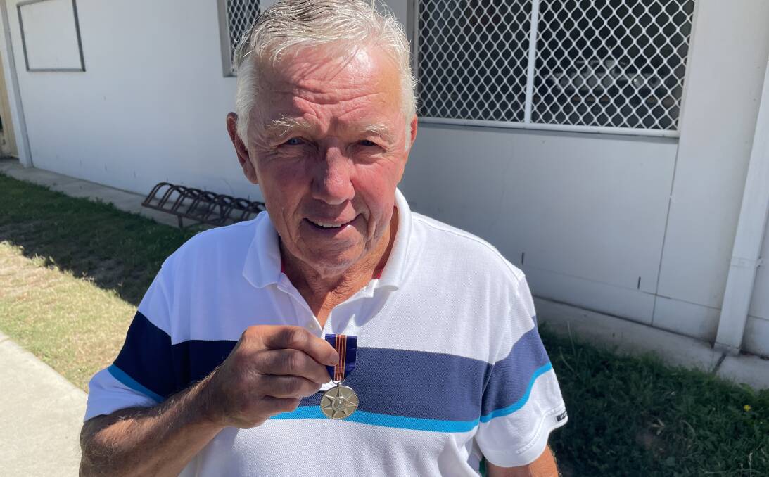 Brian Maher with his Centenary Medal presented in by prime minister John Howard