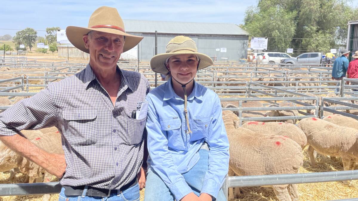 Gavin Lieschke with his son Ernie at the conclusion of the disappointing interest in the dispersal of the Bundaleer Poll Merino stud at Alma Park.