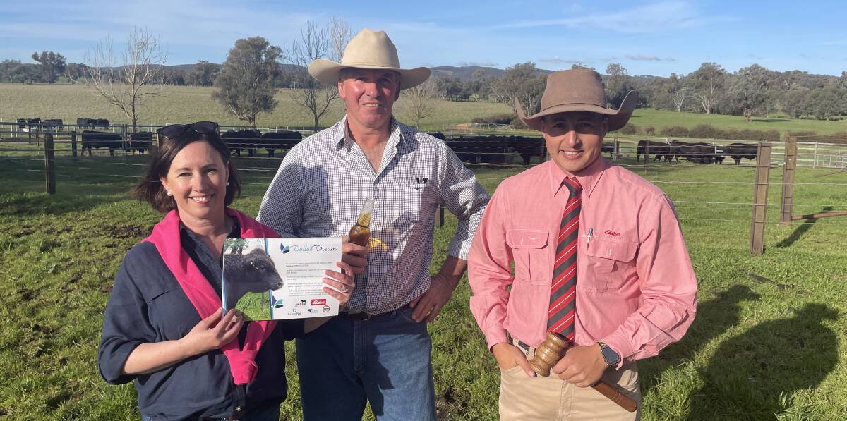 Natasha and Jock Harbison, Dunoon Angus, with Elders auctioneer Lincoln McKinlay, extremely pleased with the support they received for their 'Dolly's Dream semen package' which sold for $20,000.