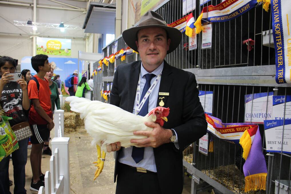 Brendan Sharpe, Uralla, with the White Leghorn pullet that made $760. Picture by Hayley Warden