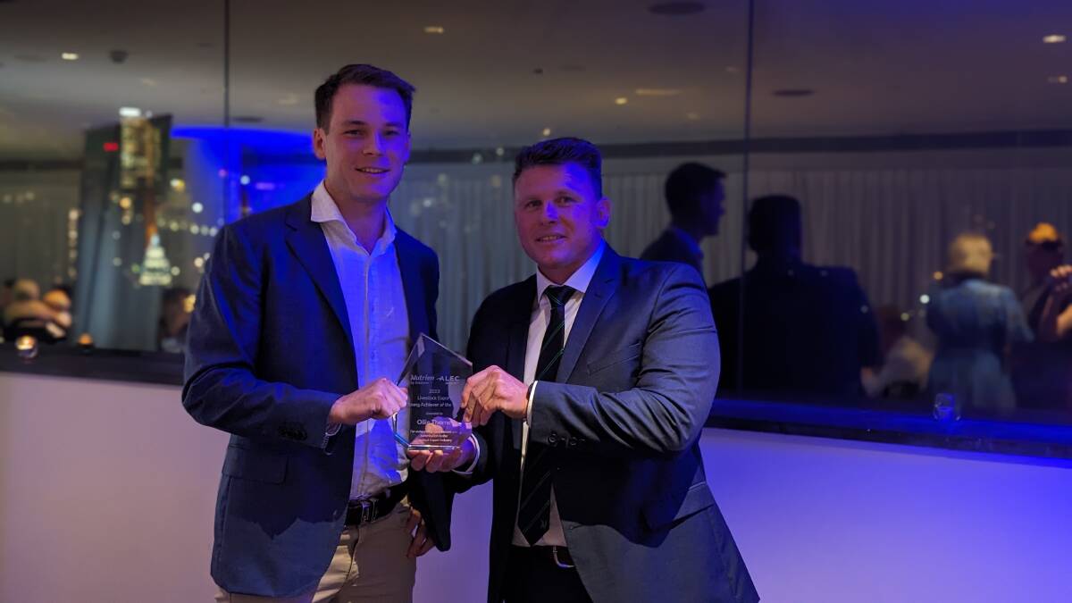 2023 Livestock Exporter Young Achiever of the Year Oliver Thorne receives the award from Nutrien's Colby Ede.