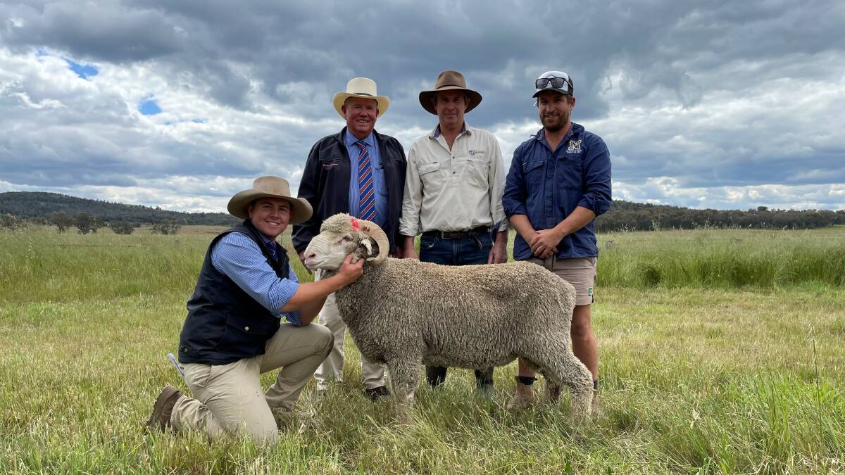 Milling and Company's Jim White holds the $3600 sale-topper with colleague Bruce Bryant; Bundemar stud principal Tom Kirk and buyer, James Nixon, Leewang, Yarrabandai, after the Bundemar Merino stud sale at Baldry.