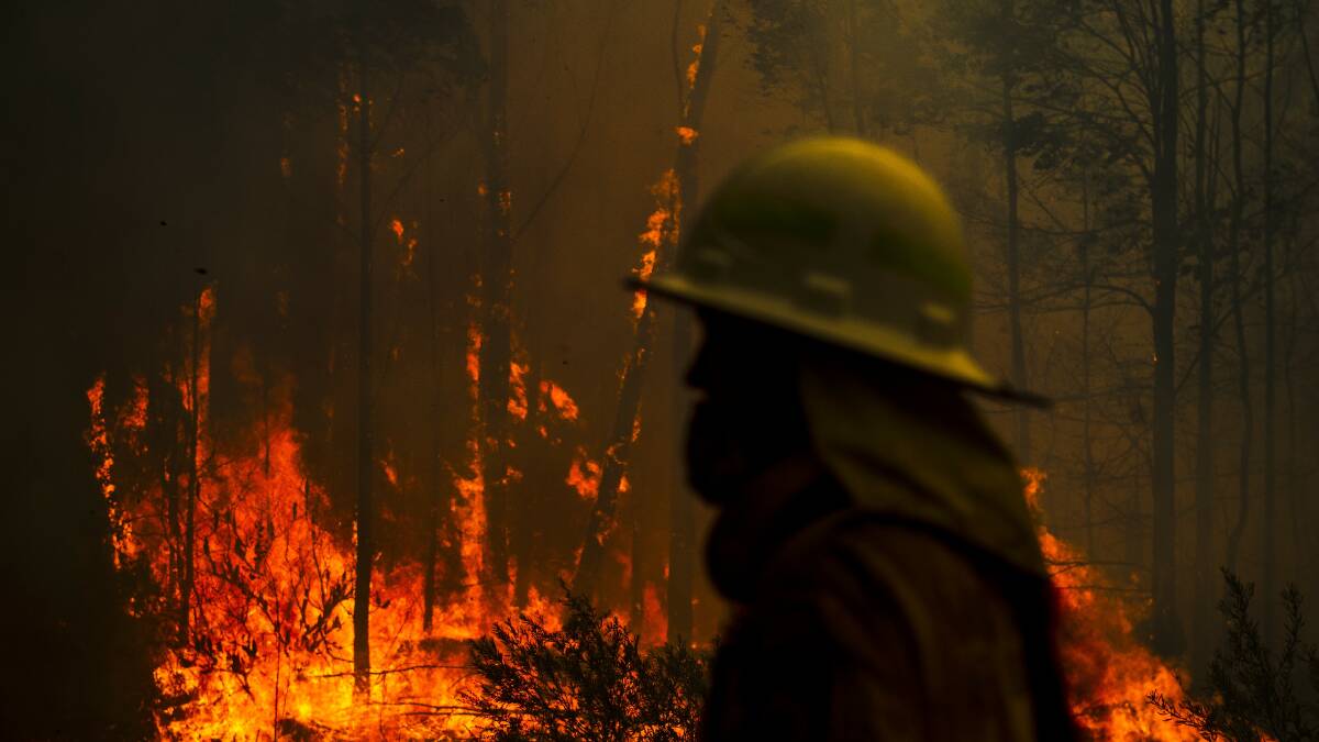 NSW RFS come to protect a property on Tallow Wood Rd from the Currowan Fire. Photo: Dion Georgopoulos