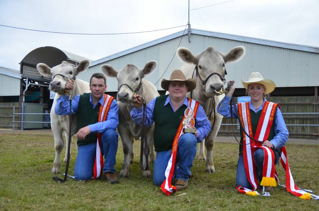 Rob Onley, Geordie Elliott and Crystal Bell, with 2016 Royal Adelaide supreme exhibit Prairie Falls Kirrabel and her twin heifer calves.