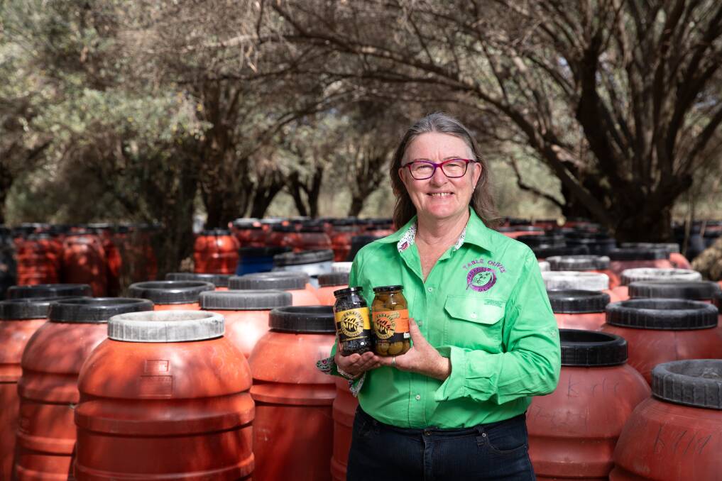 Parafield Olives' Margaret Carter with her winning Parafield Organic Table Olives Wallis variant and Parafield Organic Table Olives Dried Kalamata. Picture by Madeline Begley