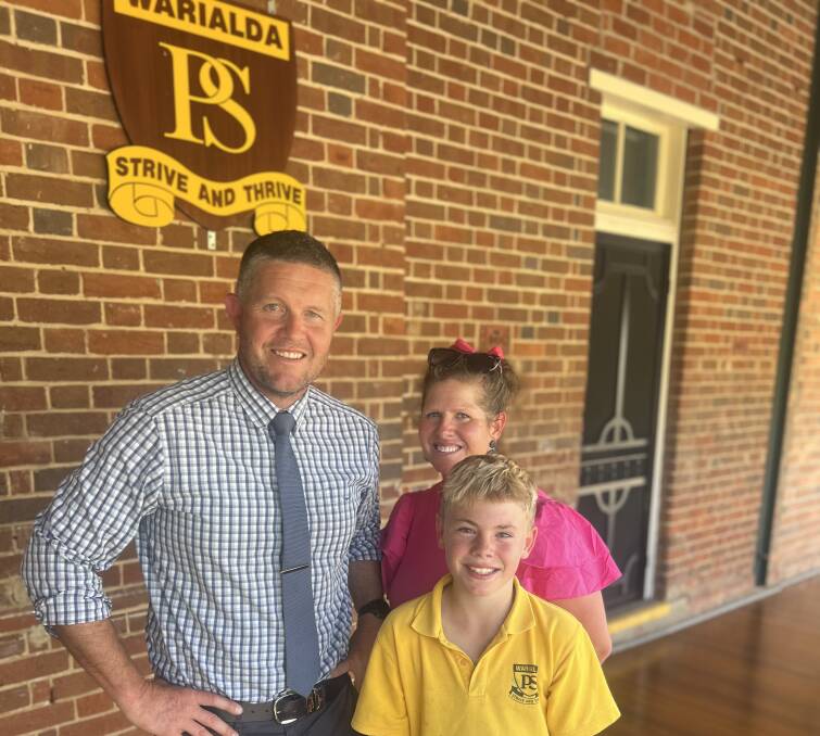 Warialda high jumper Hugo Barwick with Dan van Velthuizen and Naomi Cole from Warialda Public School, helping to prepare the young champion for the national titles. Photo supplied.