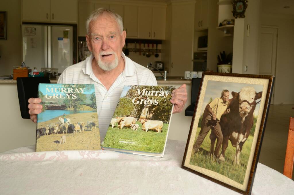 Max Stephens proudly displays the only examples he has of his lifetime work of photographing stud animals across the country.
