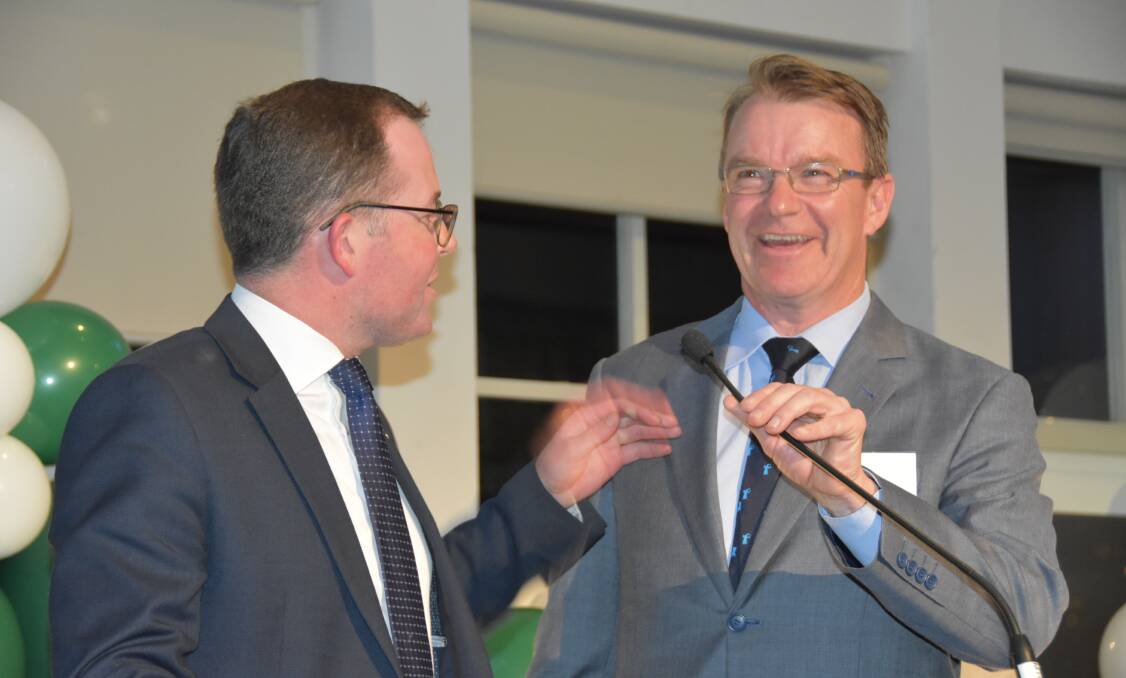 Give me the mic: IAG's Kent Hannam, principal of broker relationships and agri development, hands over proceedings to Agriculture Minister Adam Marshall at the night networking event at Luna Park. 
