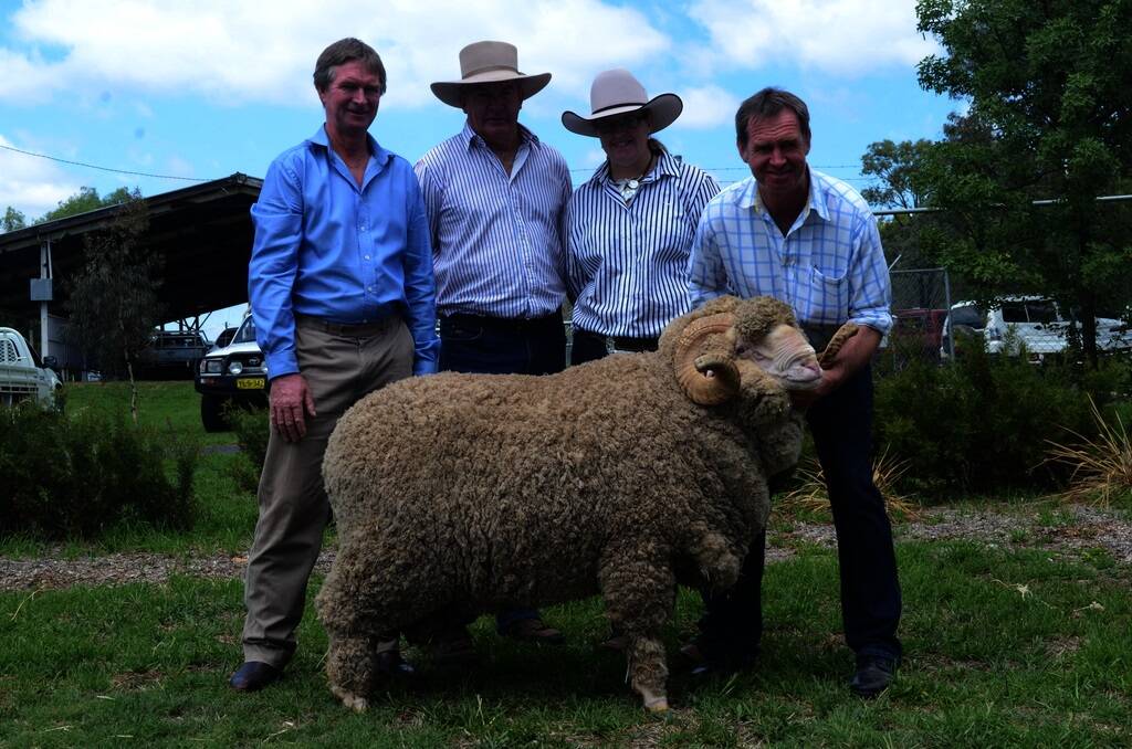 Patrick Davis, David and Jess Grills, and Andrew Davis, with the $6750 top-priced ram.