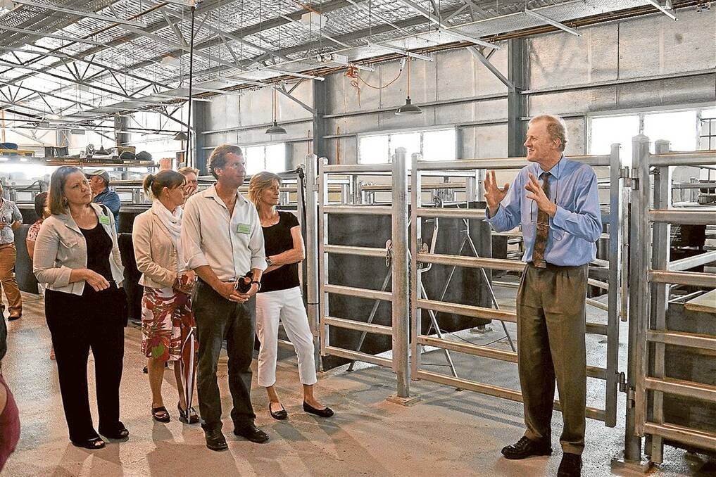 Professor of animal nutrition at the University of New England Roger Hegarty leading a tour of the university’s new large animal facility.