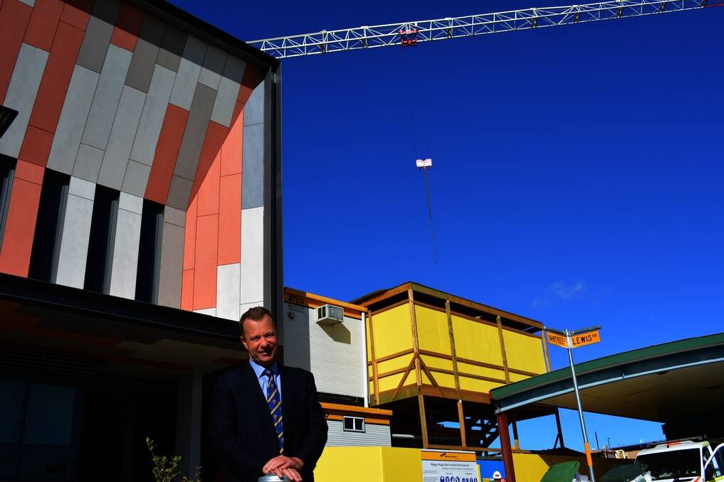 Dr Richard Harrison outside the new mental health facility and the stage two construction of a new acute facility at Wagga Wagga Base Hospital.