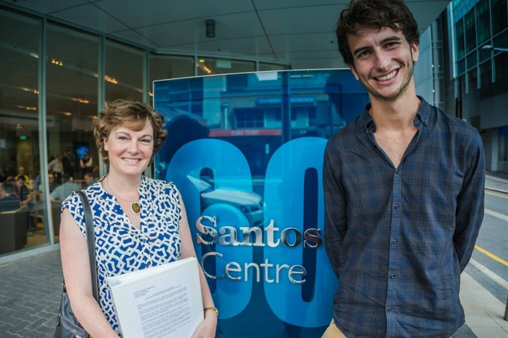 Kathryn Warhurst, The Wilderness Society and Sam Regester, GetUp! deliver the resolution forms to Santos HQ in Adelaide.