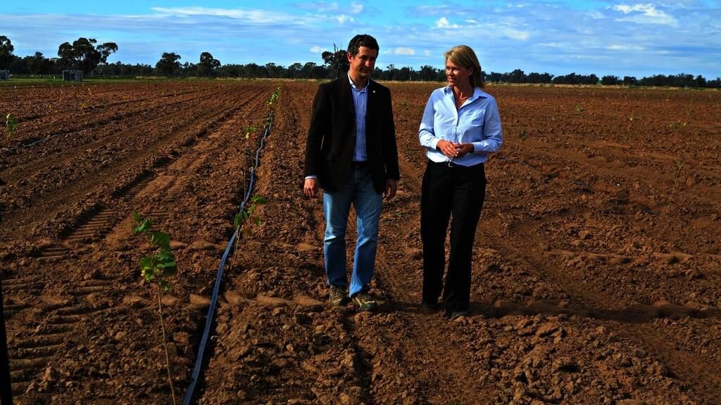 Agri Australis general manager Alessandro Boccardo with Primary Industries Minister Katrina Hodgkinson at the 2000-hectare hazelnut farm at Narrandera.