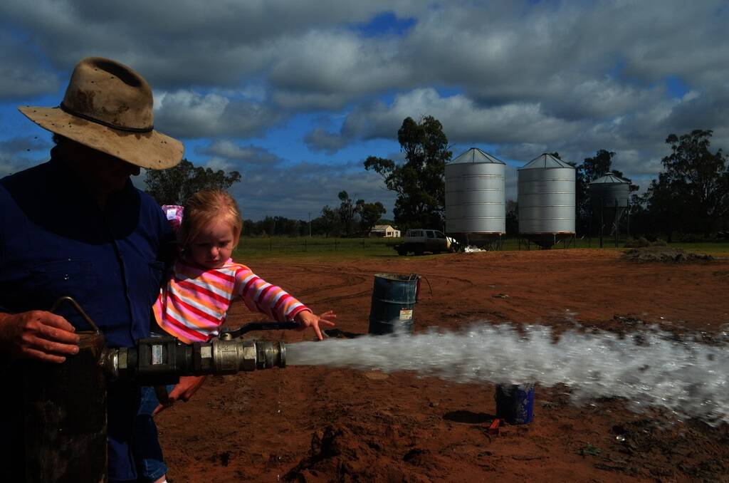 One of the families who will benefit from the community bore is Trish and Mark Wilkins, "Bexley", Pilliga who is pictured with two-year-old daughter Claire.