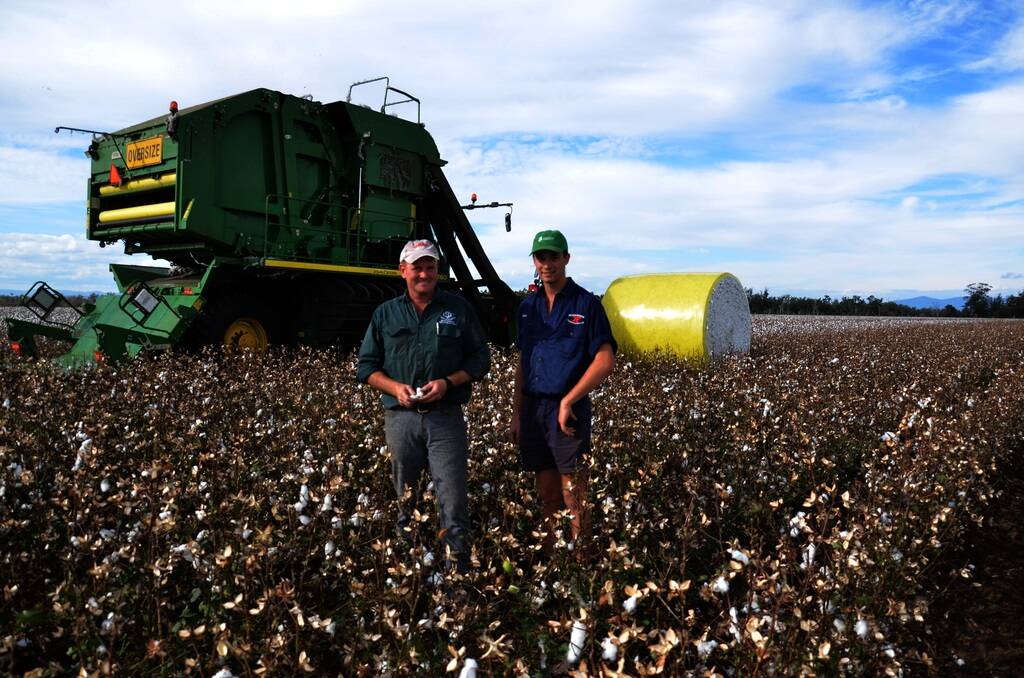 Andrew Watson and his son Kane cotton picking on Andrew's farm "Kilmarnock" Boggabri