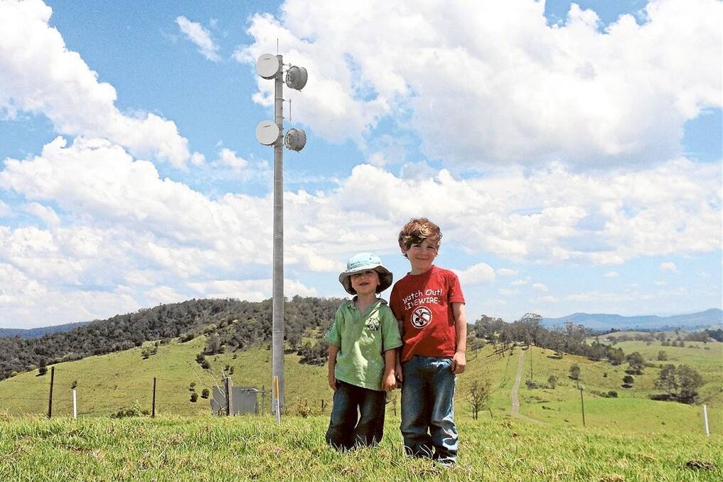Brothers Nathan Borello, 6, and Joshua, 3, are pictured on their family’s property at Simpkins Creek, on the picturesque Mallanganee Range, west of Casino. Photo digitally altered to show what a 15-metre pole would look like (not to scale).